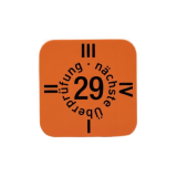 Etiqueta laranja quadrada com o ano 2029 a preto e com cada aresta identificada com I, II, III, III. Ou seja, cada lado do quadrado tem um semestre do ano associado que deve ser sinalizado quando é feito o registo